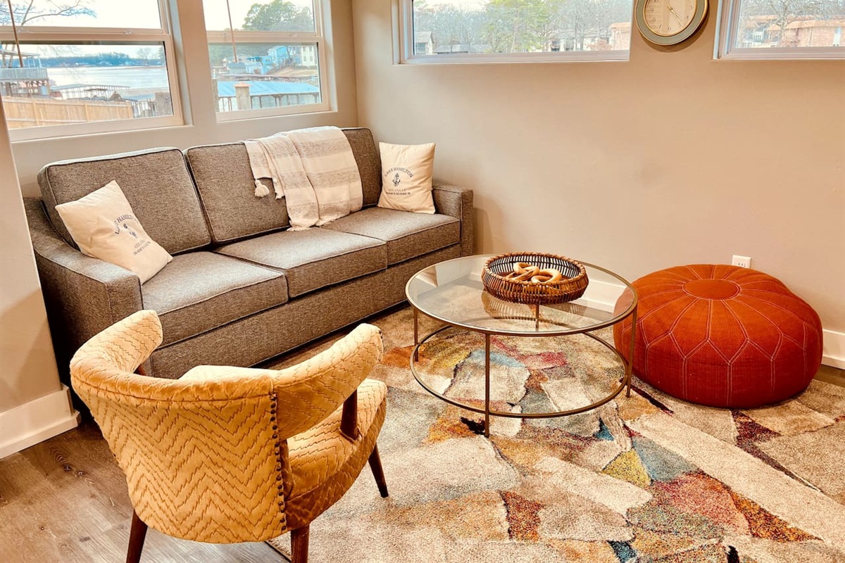 Living Room Retreat: Bright, stylish space with stunning views and comfy seating for relaxation!