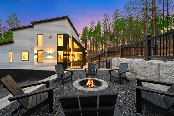 Adirondack chairs encircle the firepit, creating the perfect spot for s’mores and conversation.