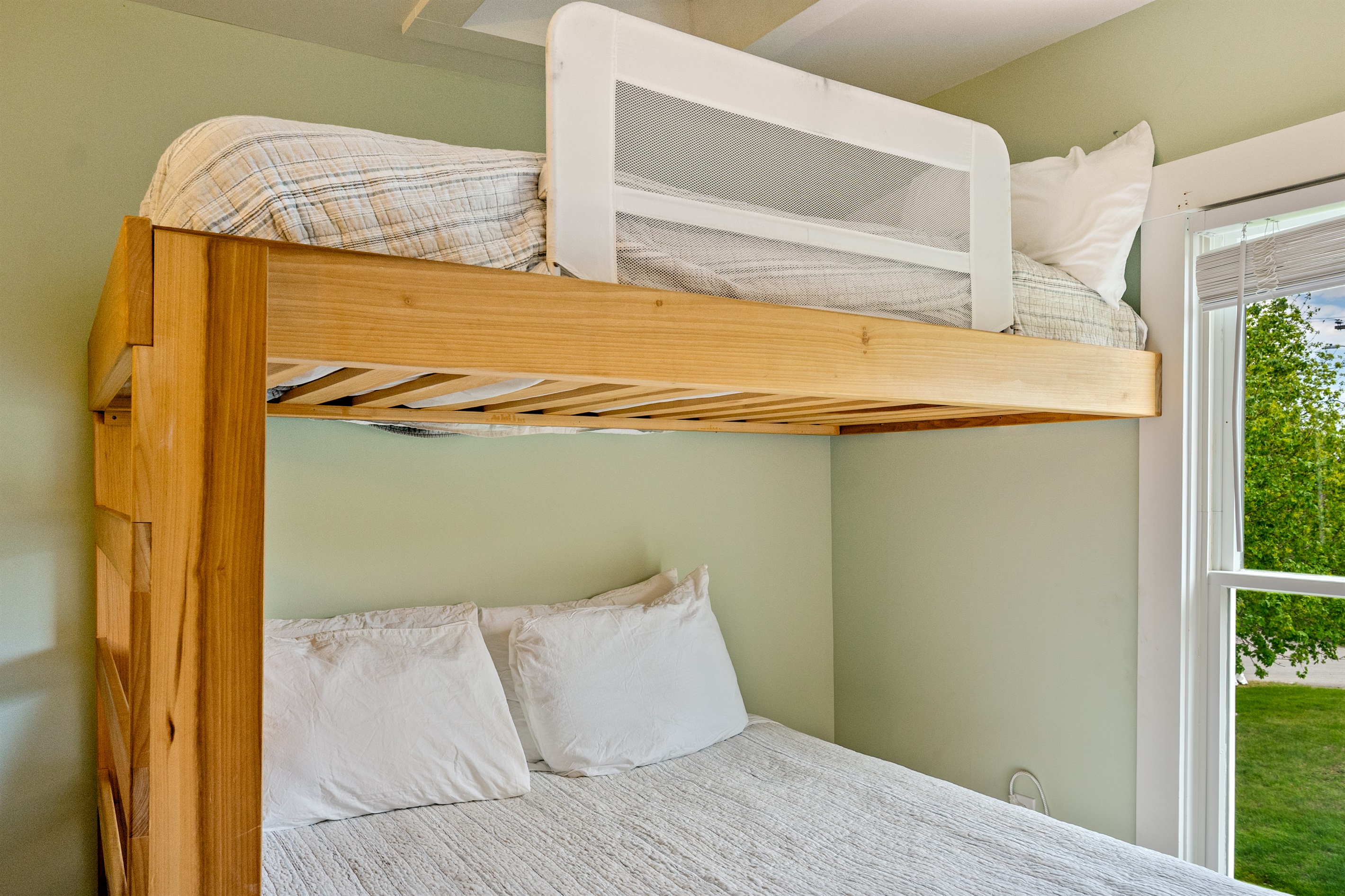 Safe and flexible family sleeping. Our Beech Room twin-over-queen bunk includes a safety rail for peace of mind. A bright, airy basecamp in Hall Quarry, perfect for kids or adults resting up after a day on the MDI Quiet Side trails.
