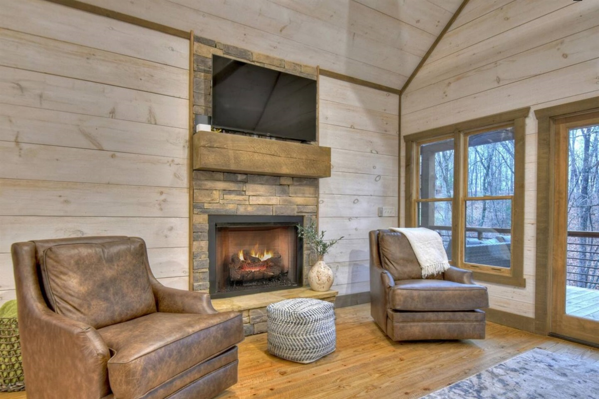 Lower level family room complete with comfy seating and gas fireplace, and TV. The perfect place to watch the big game!