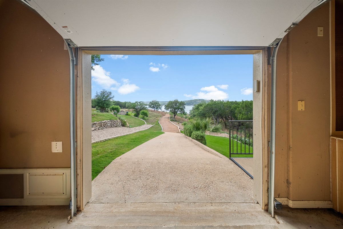Tuscanys garage has two doors. Enter through the first door and exit through the back door to the cart path that leads to our private dock.