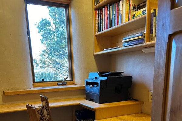 Home office, plenty of space, lots of books and reliable air printer/scanner.