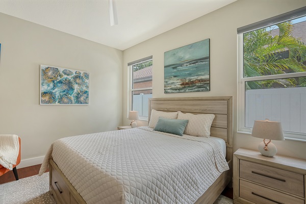 Drift off to sleep on a comfortable Serta hybrid mattress with views of the tropical plants outside the window