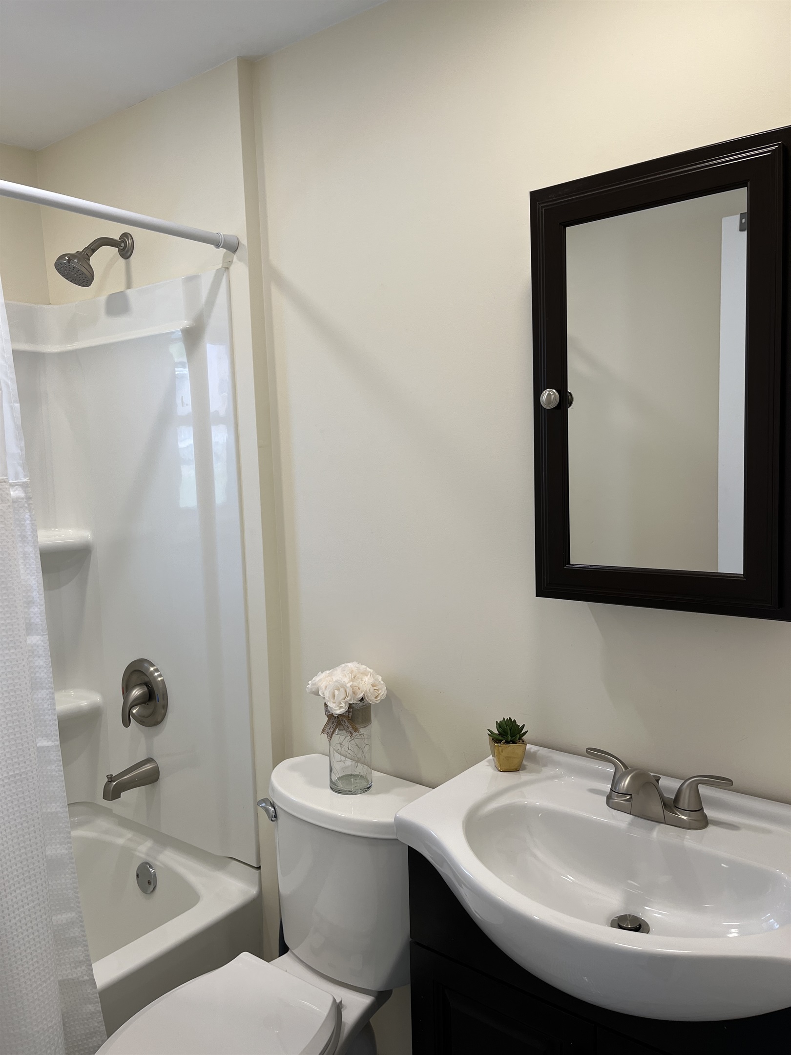 Full bath just outside bedroom with tub/shower