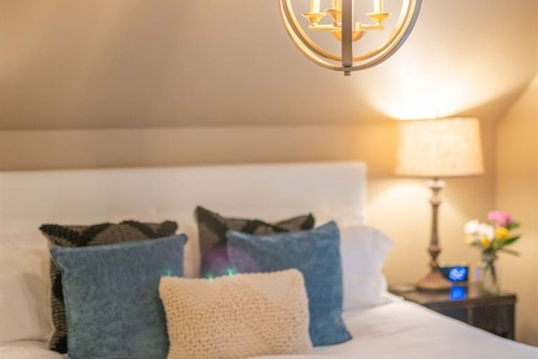 Ambient lighting designed to create a cozy and inviting atmosphere throughout the primary bedroom.