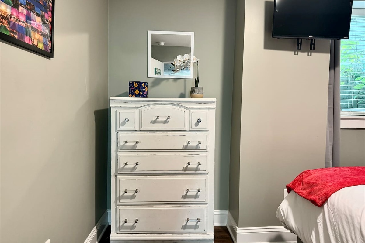 Unpack and stay a while with storage space in the dresser and closet.