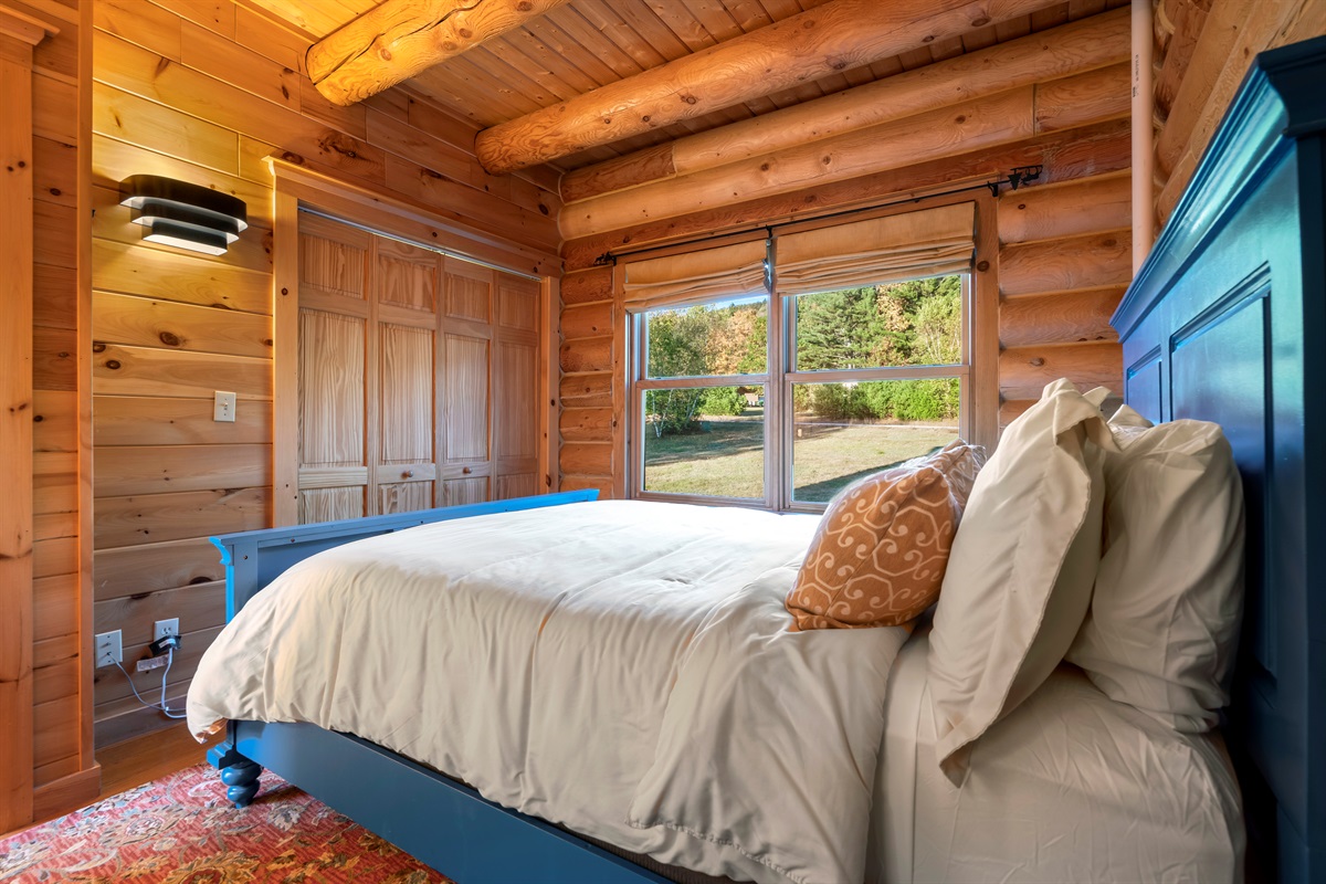 Relax in these cozy main level bedrooms with queen beds and dressers.