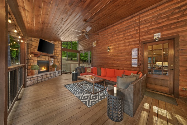 The large covered deck with smart tv and a gas fireplace let's you enjoy the evenings outside listening to nature.