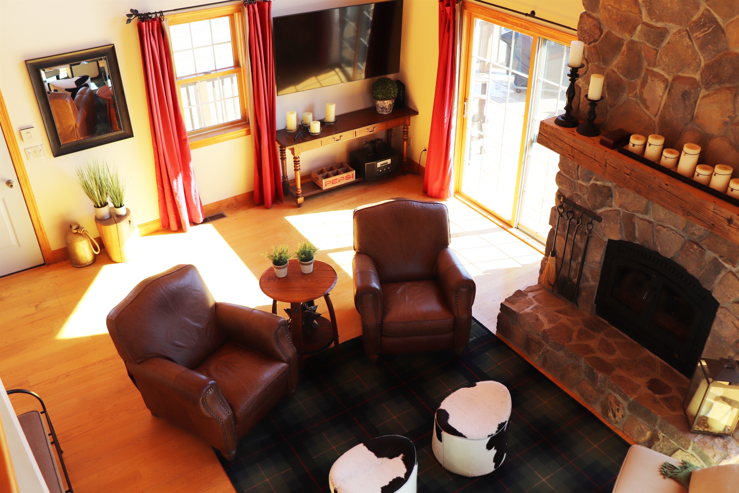 View from landing above looking down on the living room and fireplace.