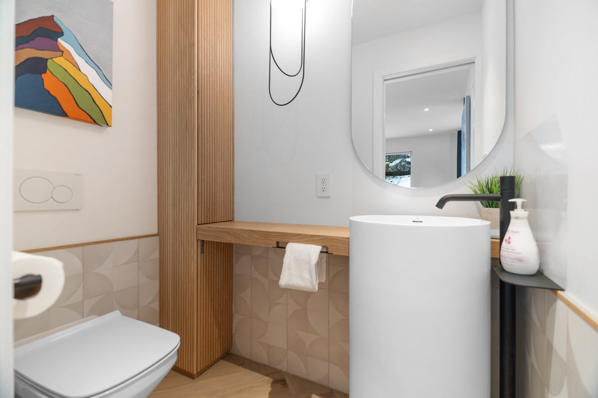 Main-floor powder room with pedestal sink