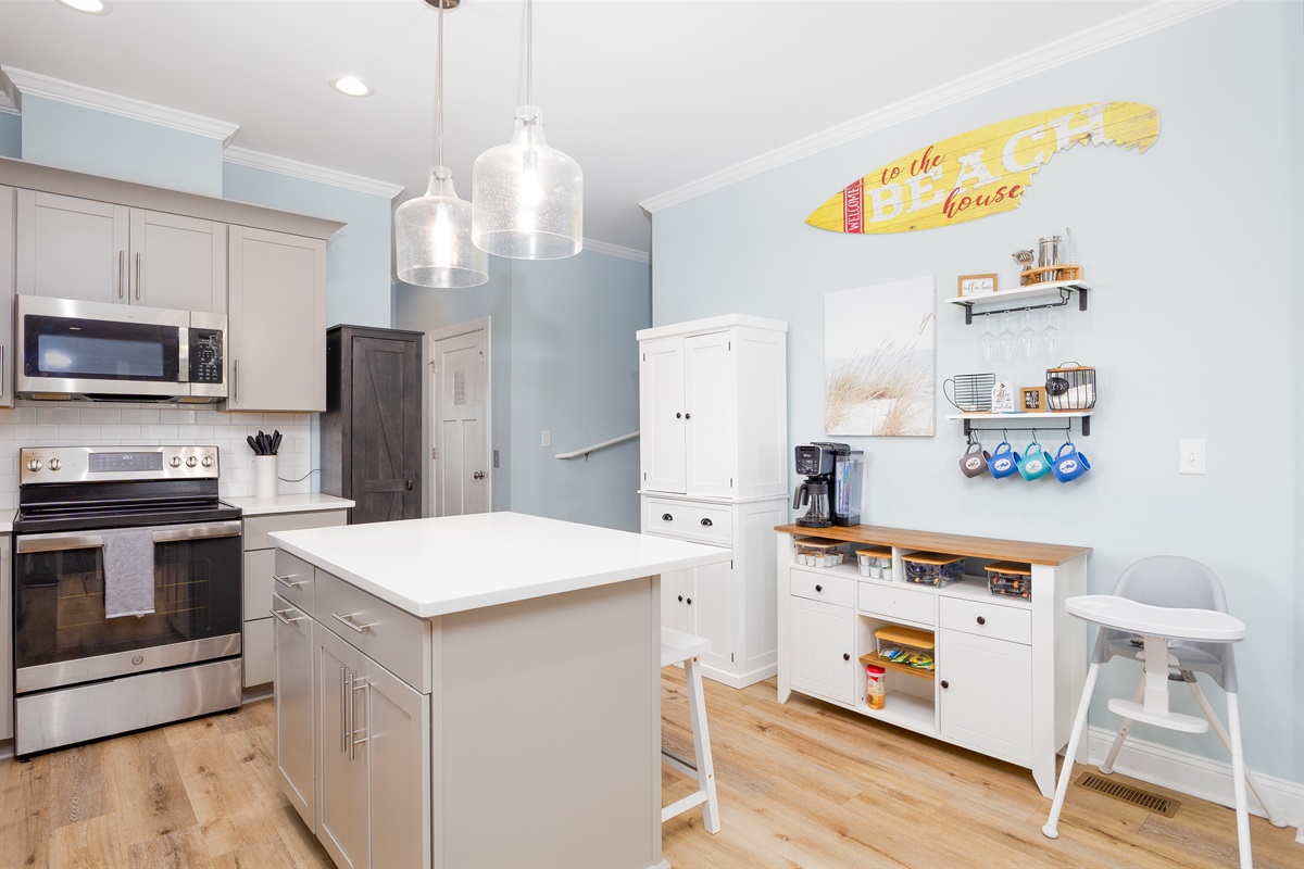 This well-appointed kitchen offers a blend of modern amenities and charming decorative accents
