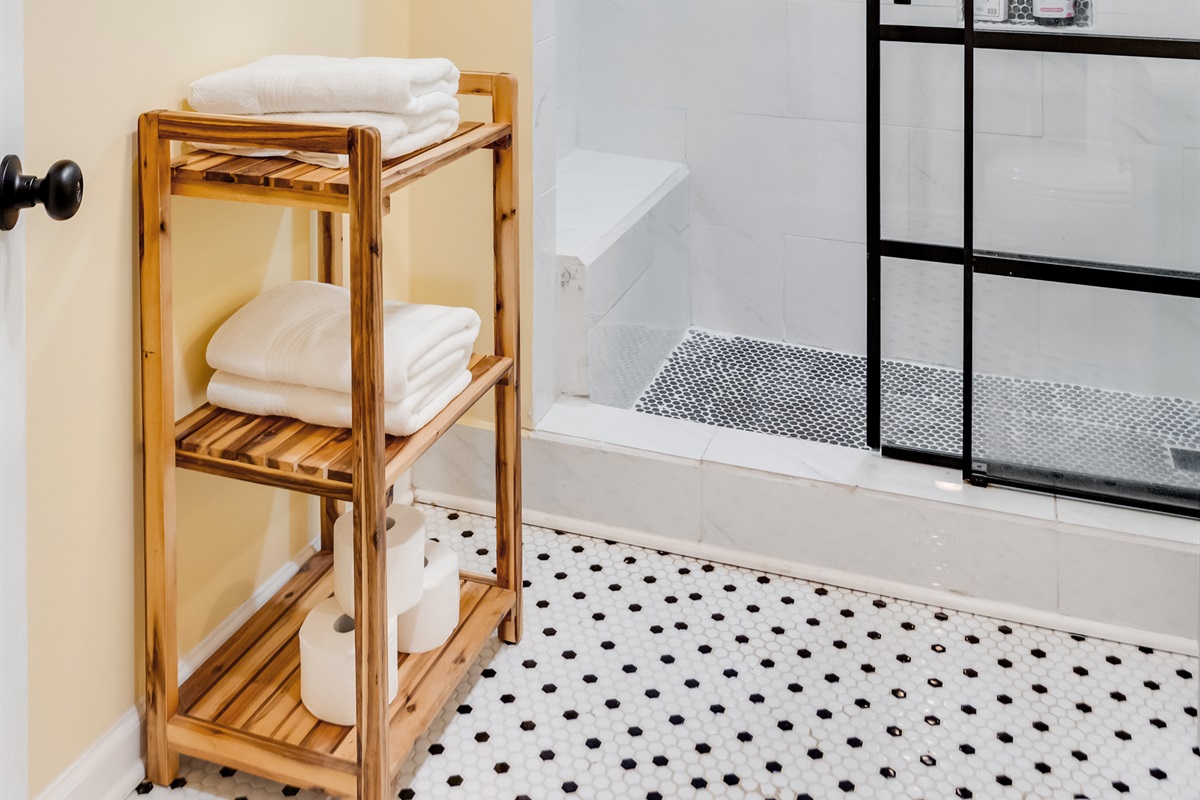 Downstairs Bathroom 3: Enjoy a sleek, modern shower and fresh linens in a bright, airy space!