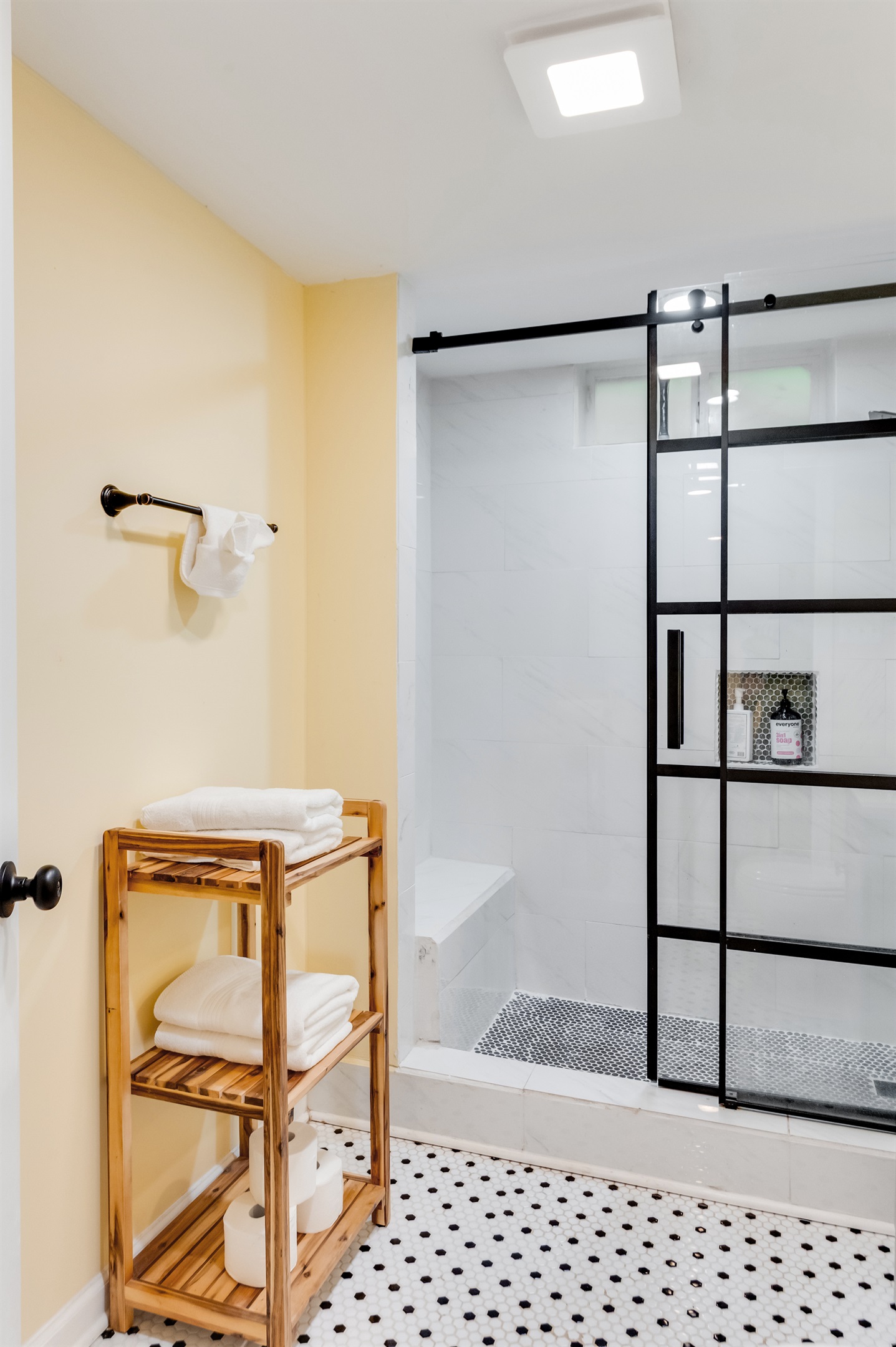 Downstairs Bathroom 3: Enjoy a sleek, modern shower and fresh linens in a bright, airy space!