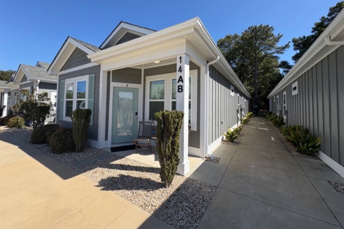 Side exterior view with private entrance walkway
