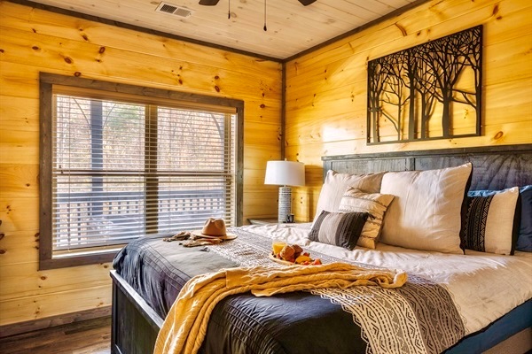 Sleep in on your Smoky Mountains vacation in the king suites overlooking the woods at MistyOak Cabin.