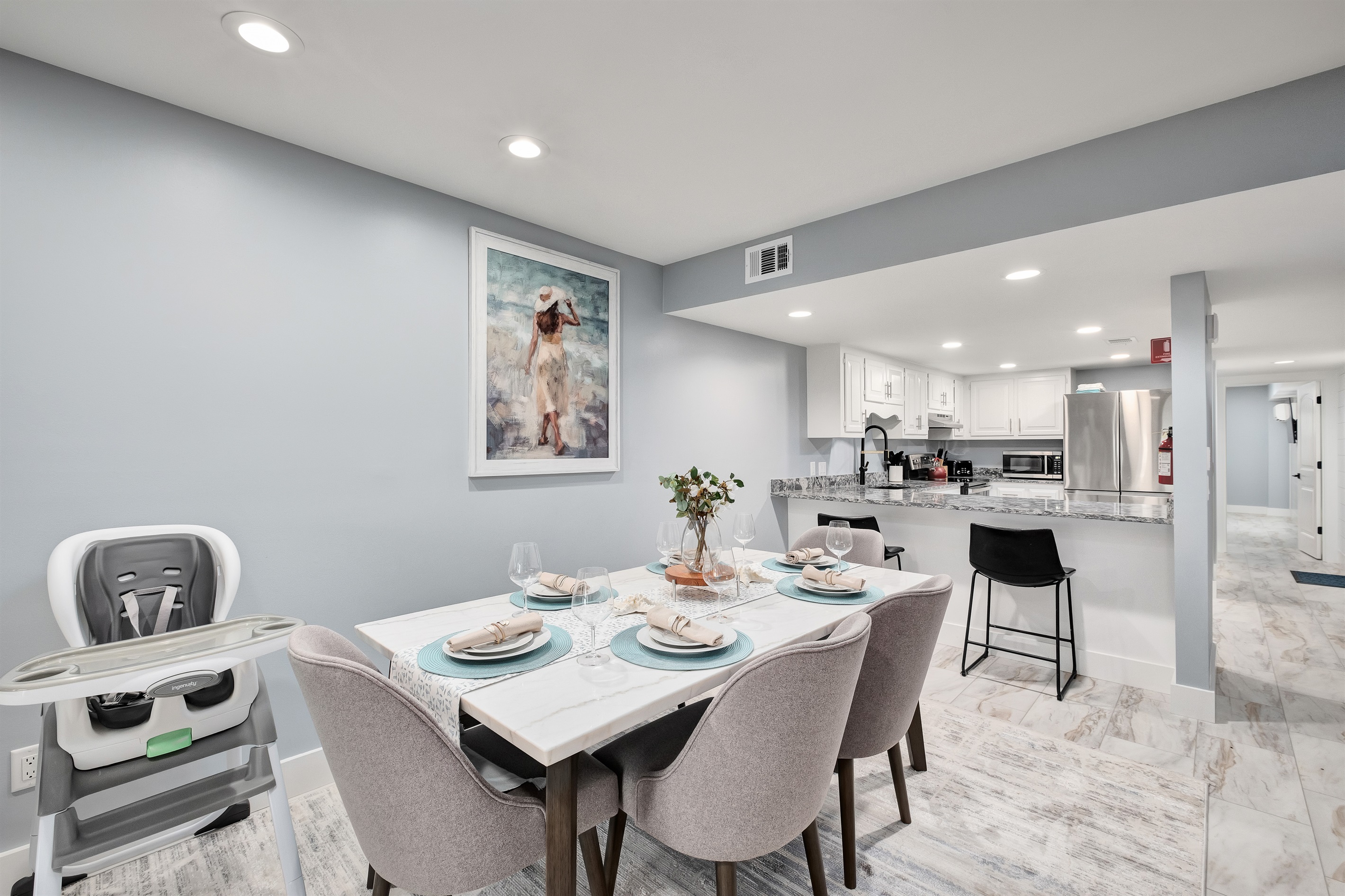 Enjoy family meals in the elegant dining area, equipped with a high chair for young children.