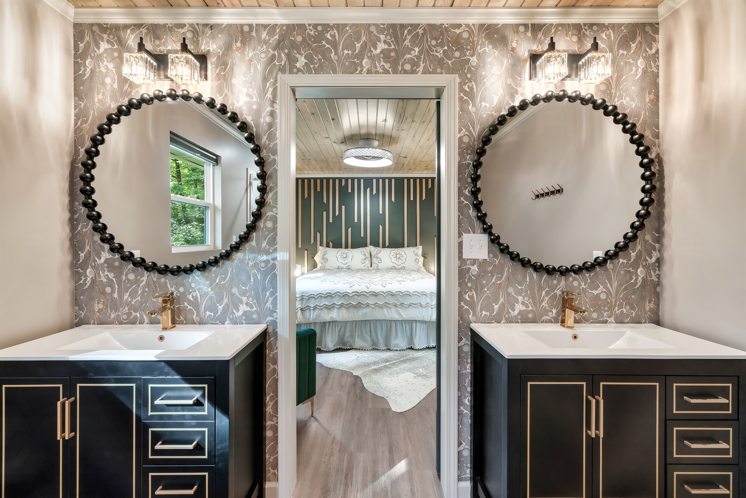 Step into Mid Mod Mountain Bliss! This show-stopping master bath flows perfectly into your private, serene sleeping space.