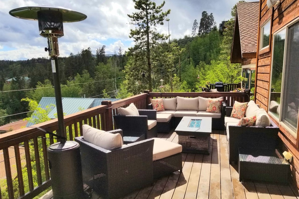 Amazing views and an abundance of seating on the upper deck facing the lakes. Overhead heater and fire table