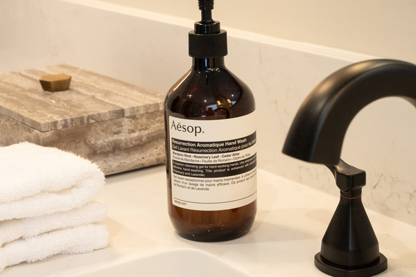 Aesop hand wash and refined bath details bring a boutique-hotel touch to every suite