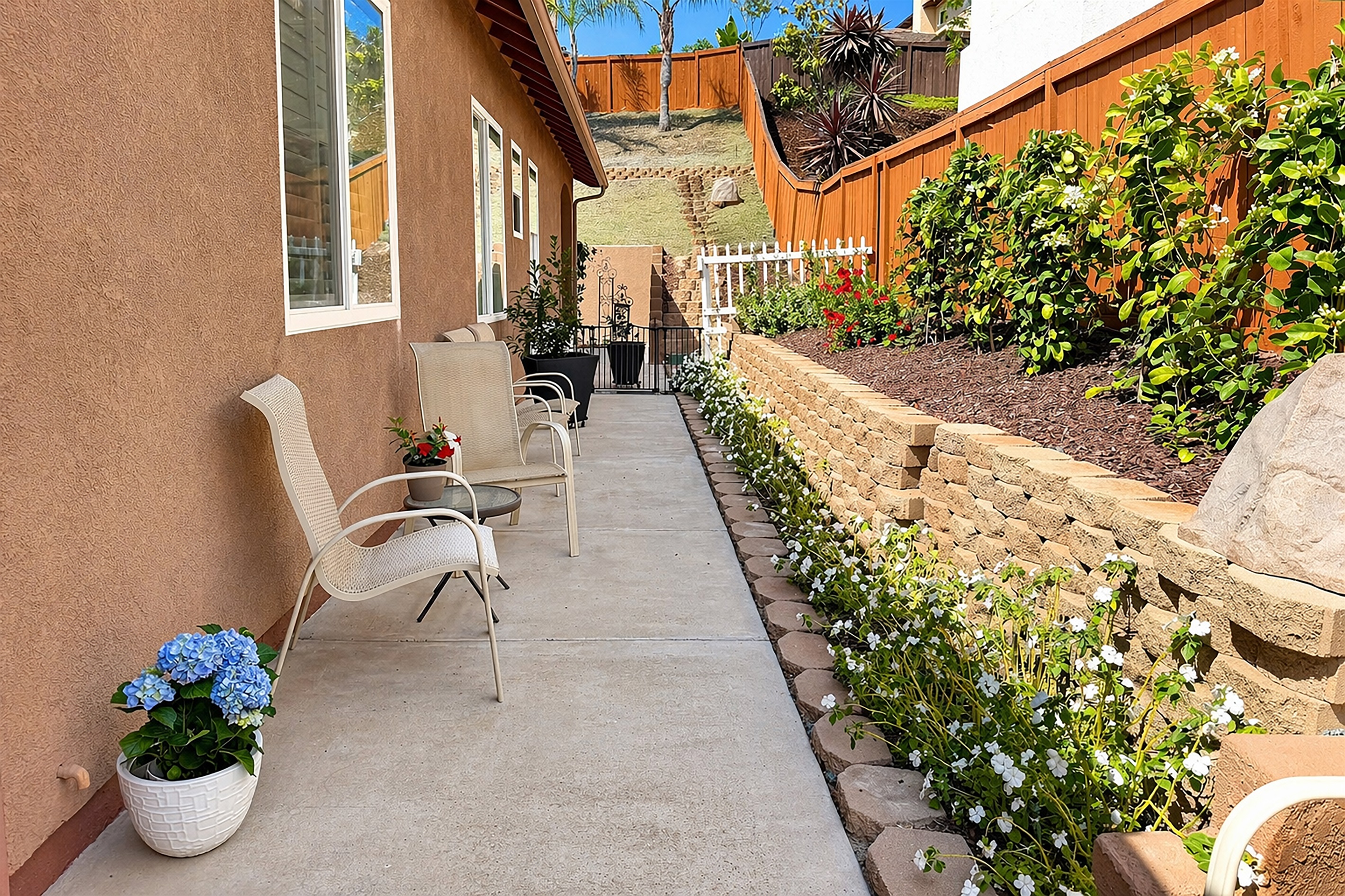 Landscaped walkway with flowers and private guest access