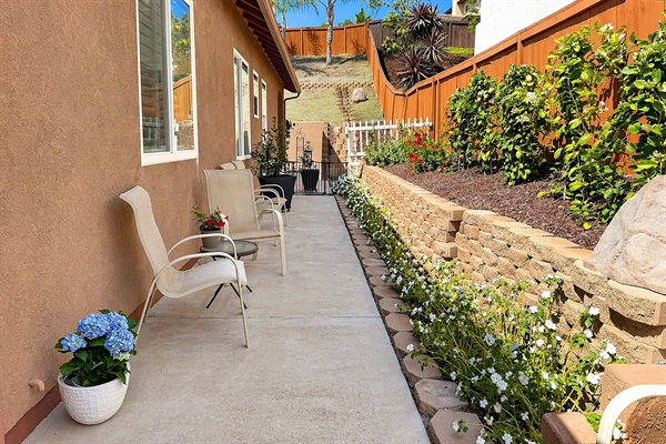 Landscaped walkway with flowers and private guest access