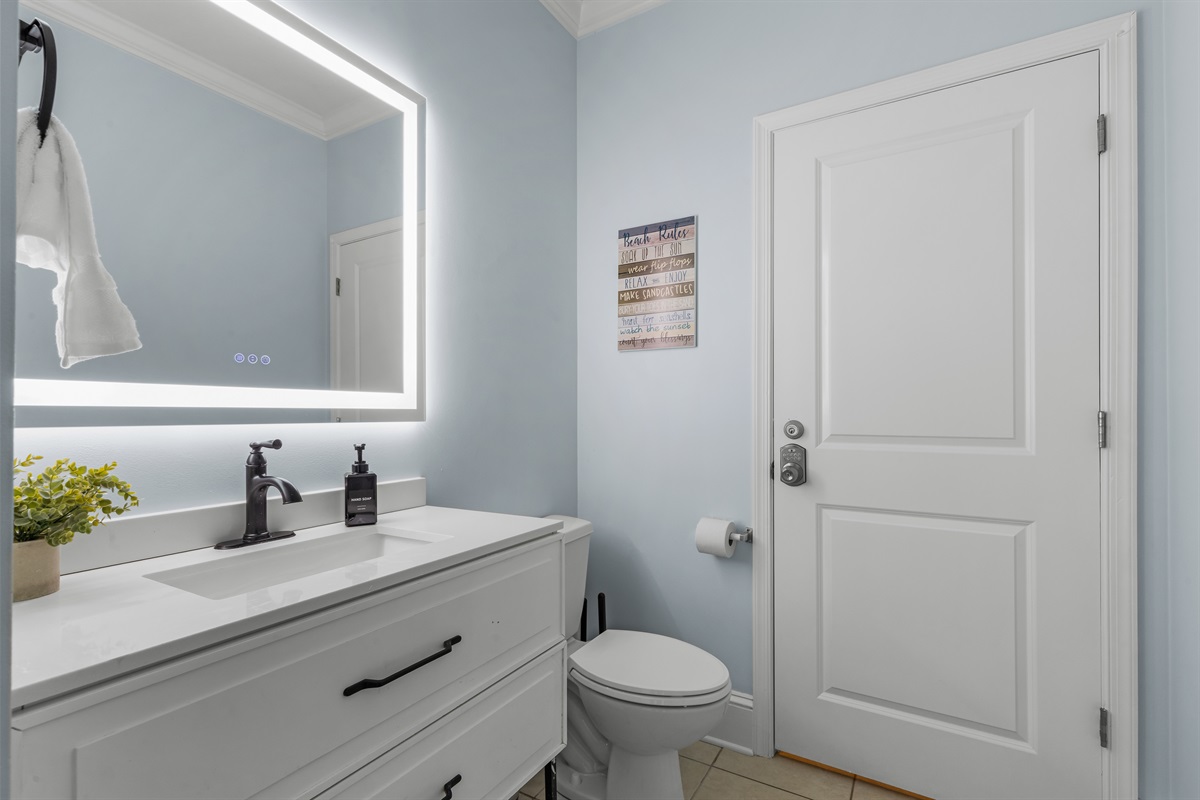 Half bath located near the kitchen on the main level