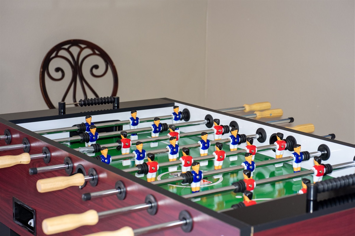 Bring the whole crew together in this spacious game and dining area featuring tile floors, stylish décor, and games that’ll keep everyone entertained.