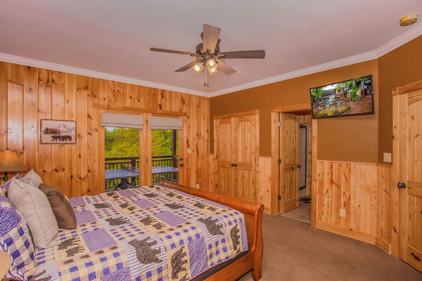 All rooms are equipped with televisions, this one opens to the deck, Splashing at the Bluff