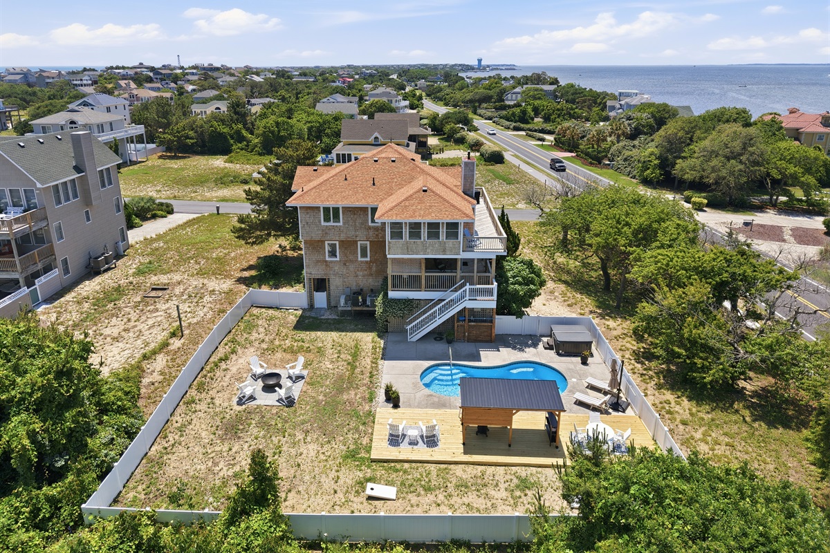 Bird’s-eye view of the property with private pool and outdoor lounge areas