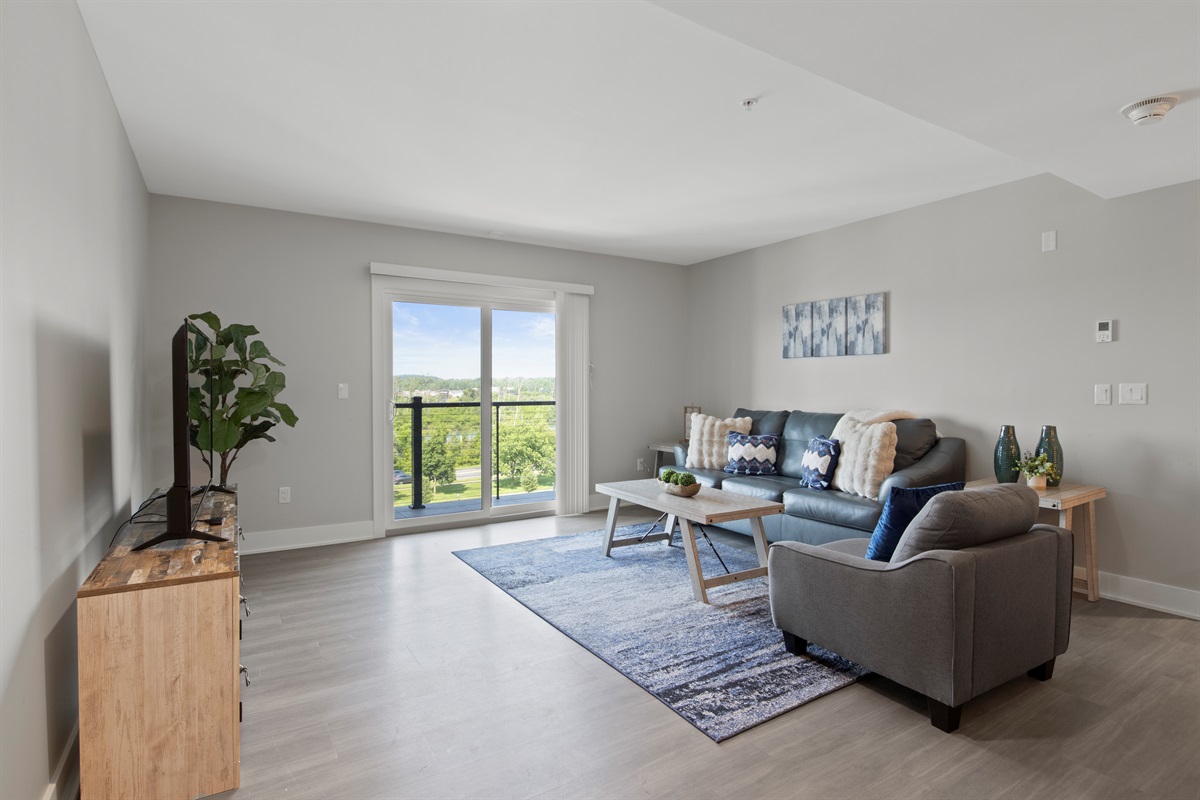 Cozy living room with a plush sofa, stylish coffee table, and calming decor for a perfect relaxing space.