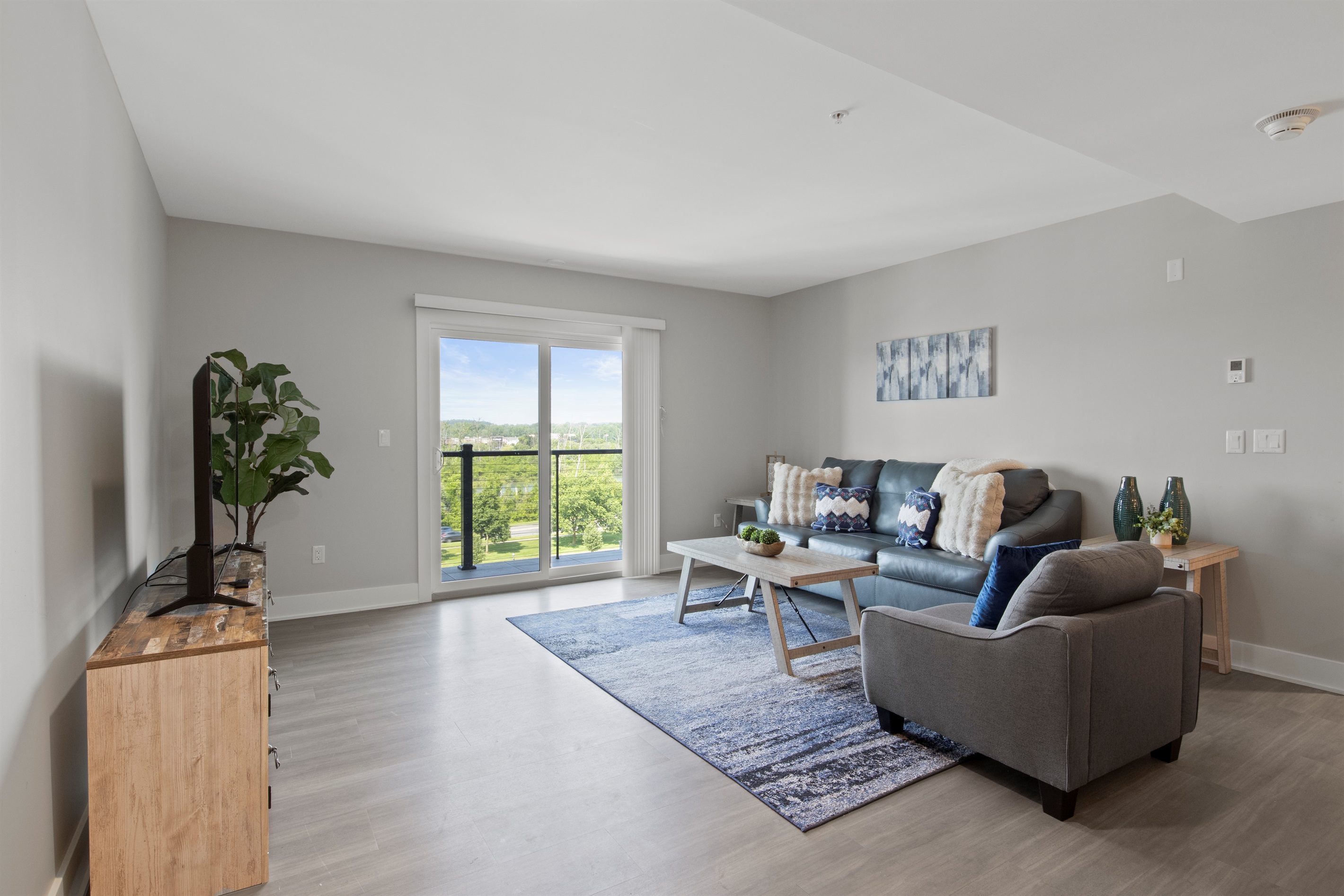 Cozy living room with a plush sofa, stylish coffee table, and calming decor for a perfect relaxing space.