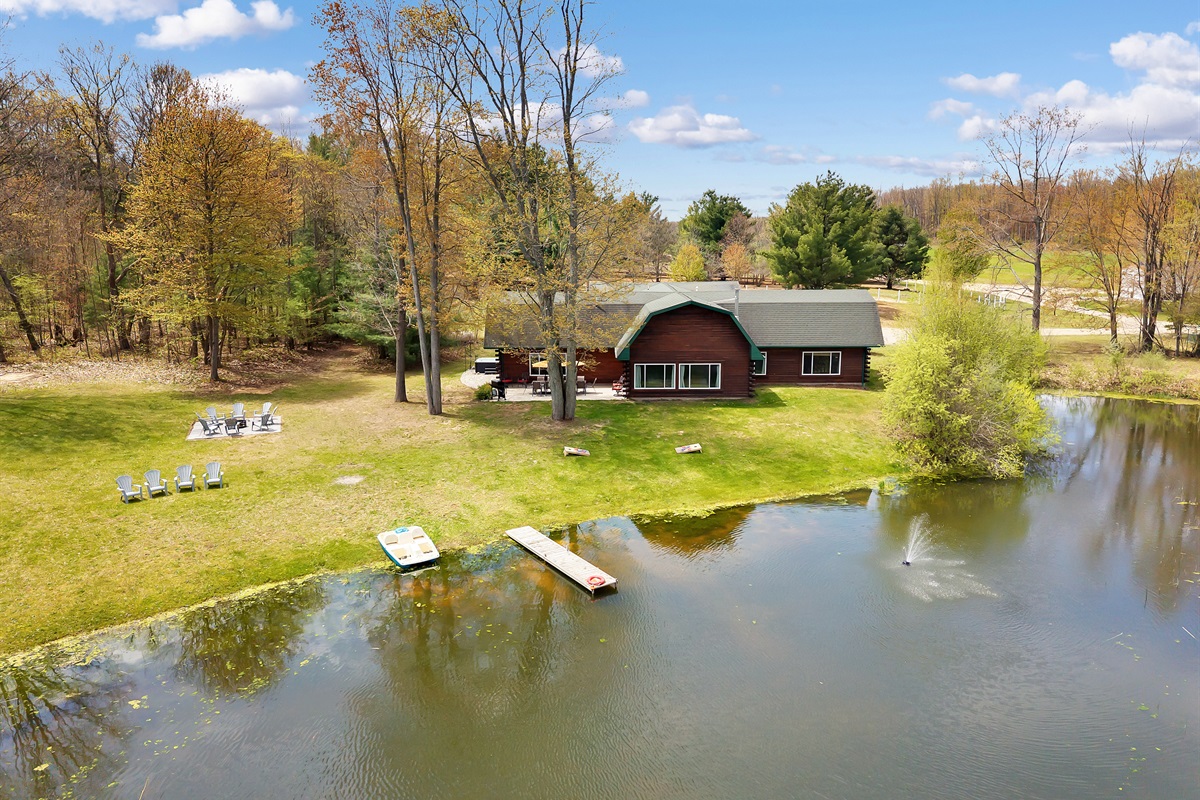 Aerial view of our home, dock, and paddle boat from the pond.