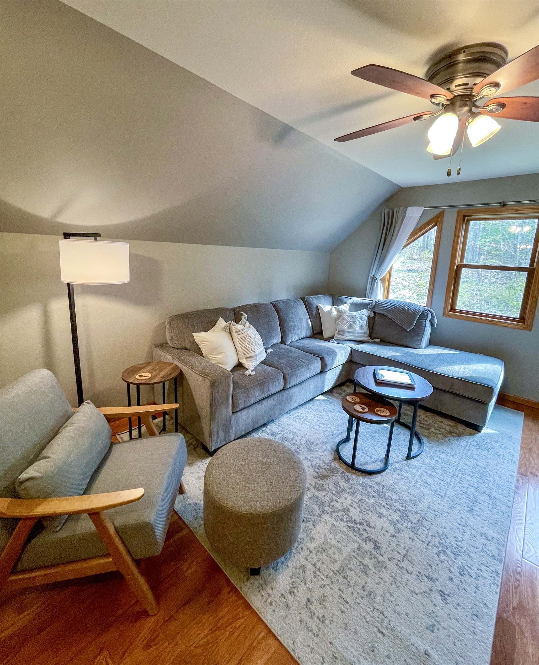 Upper level living room open floor plan to kitchen with large window. New* memory foam sofa sleeper queen 