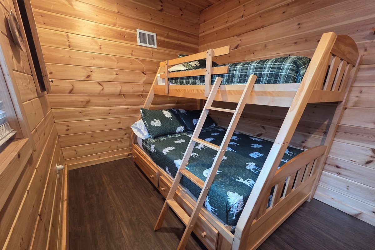 The main-level third bedroom offers a bunk bed with a full-size bed on the bottom and a twin on top, perfect for kids or extra guests.