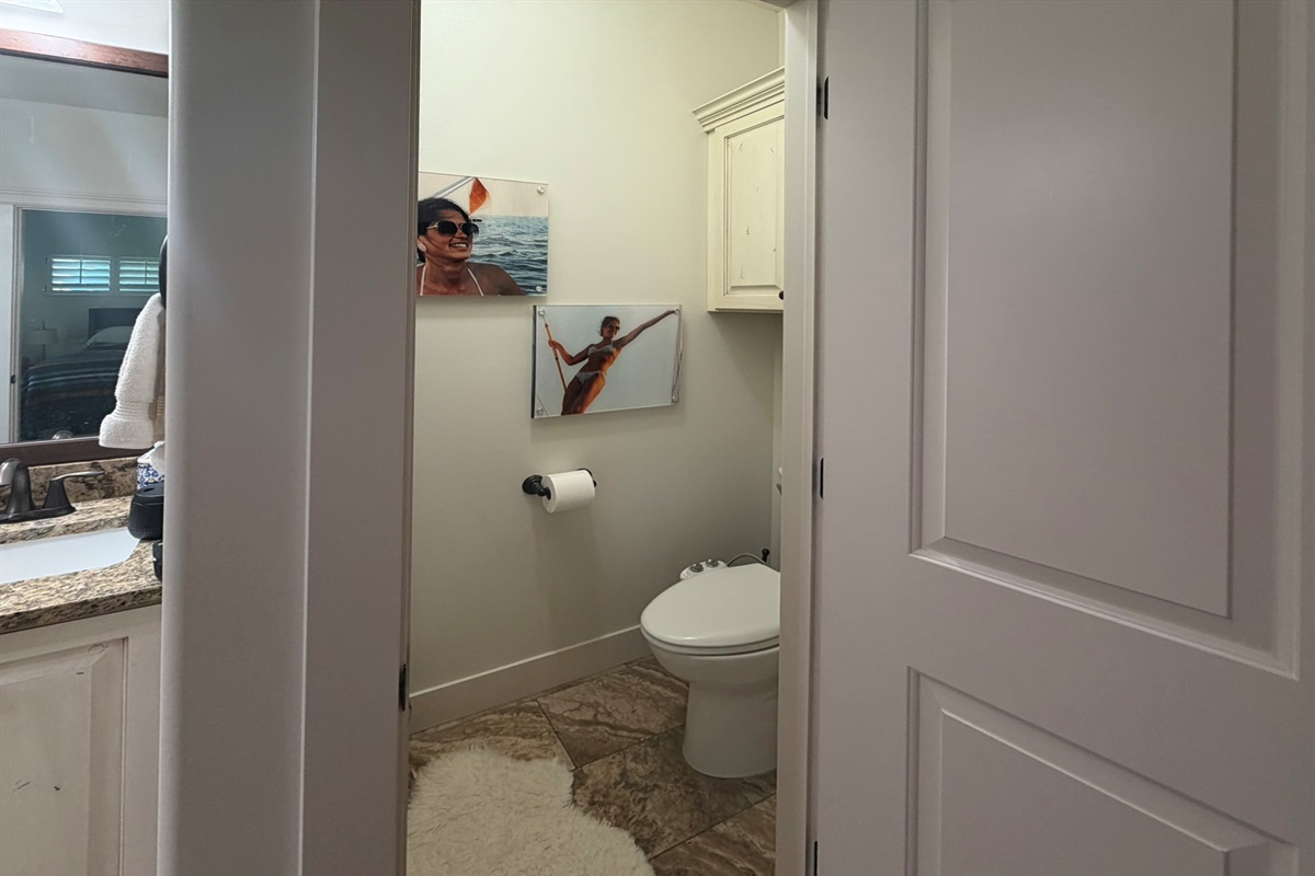 Spacious primary bath with private water closet and beautifully designed spa-style layout.