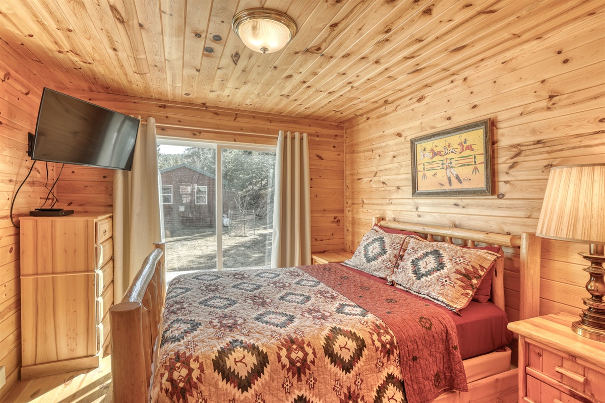 Bedroom 1 with Queen bed and TV