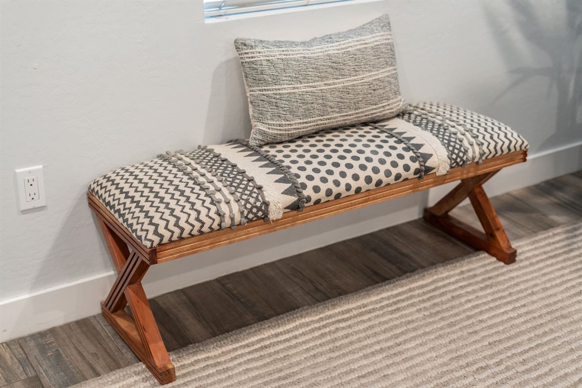 Sleek and inviting living room space with tasteful accents, vibrant art, and ample natural light for a relaxing vibe.