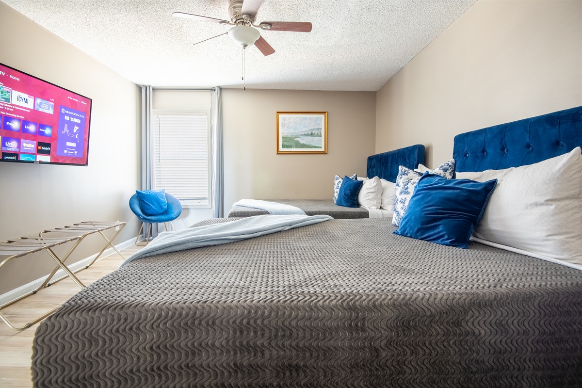 The first double queen bedroom has plenty of room for up to 4 people and even has an extra place to sit and read if you so choose.