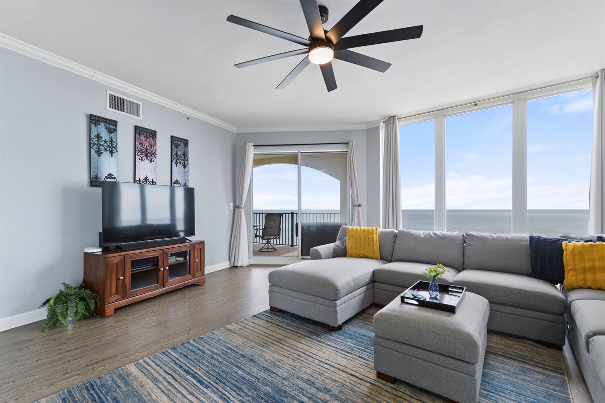 Living room; 60" 4k Roku TV, oversized sectional sofa. 