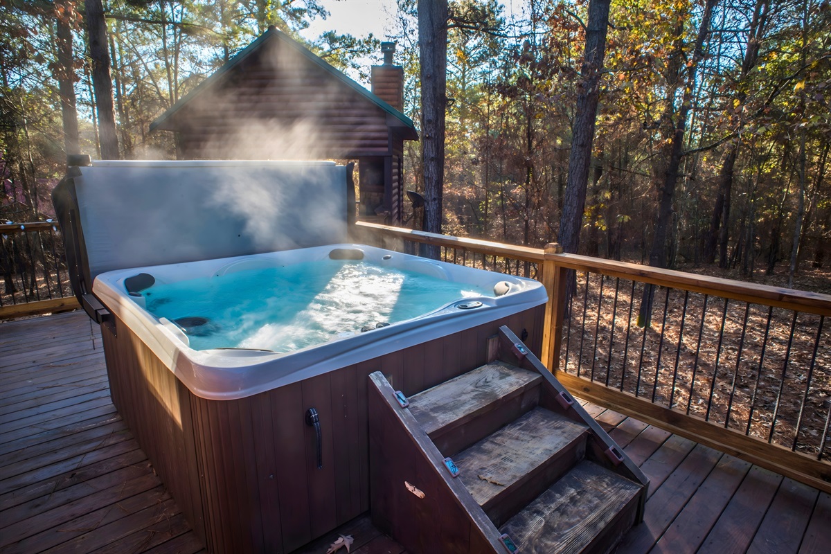 Nestled in the trees, the private hot tub invites you to slow down.