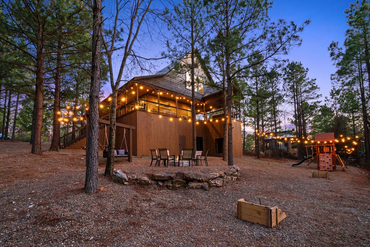 With string lights and a warm glow, this fire pit area feels extra magical once the sun goes down and the woods get quiet.