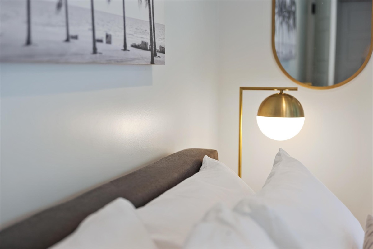 bedside lamp and comfy pillows