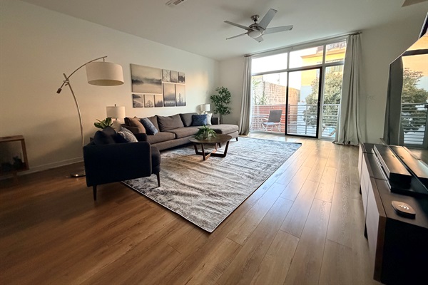 Main living space looking toward the living room and balcony.