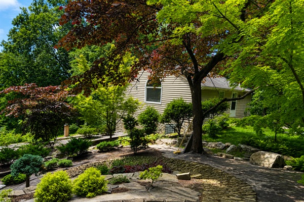 View overlooking lush Japanese Garden with stone pathways