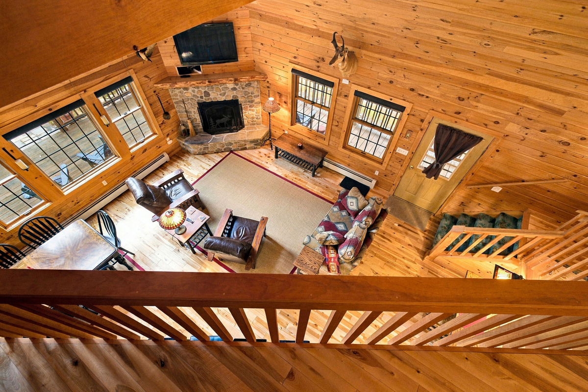 The loft overlooks the impressive great room and its soaring cathedral ceiling.