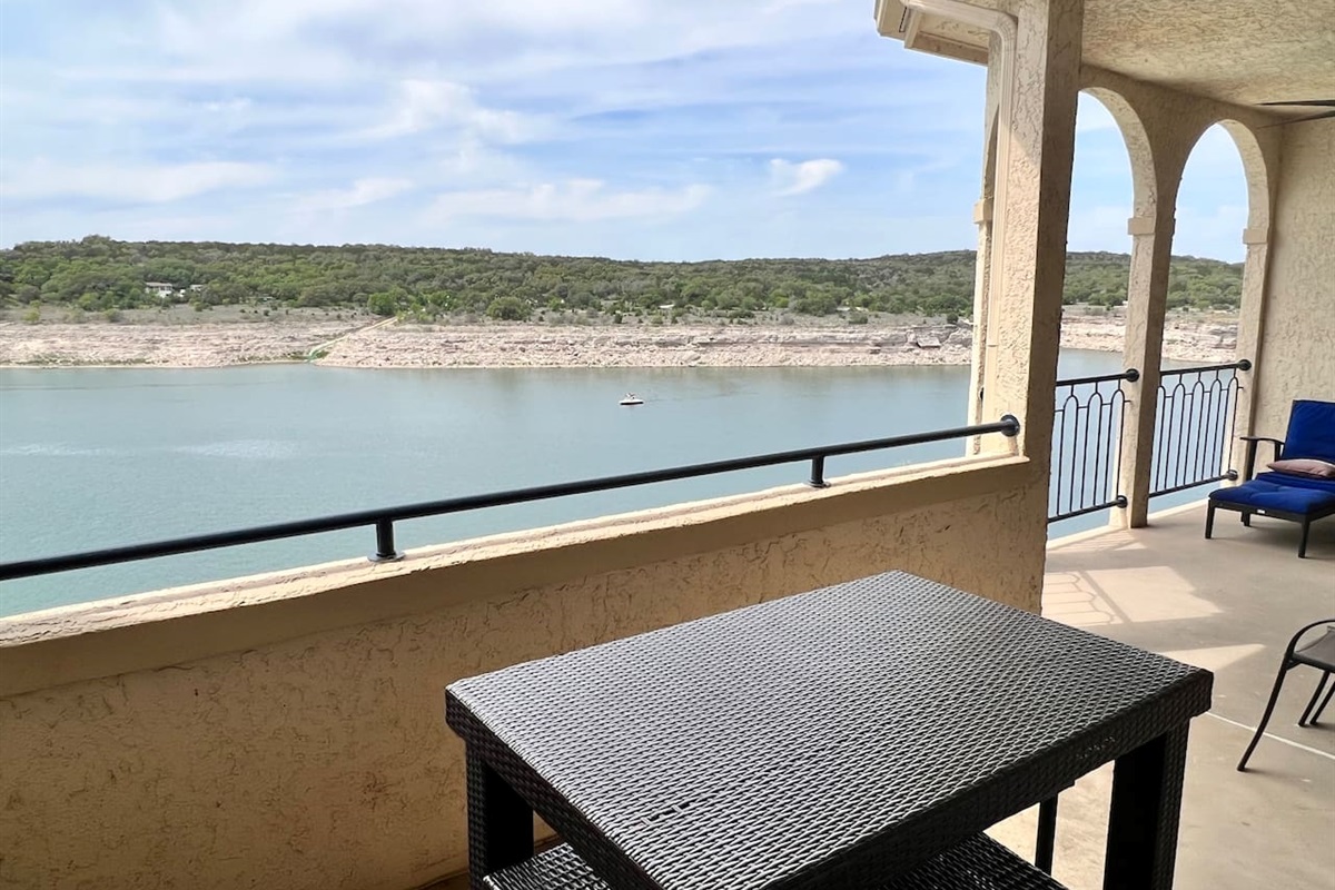 Lakefront Patio with Dining Table and Lounge Chairs
