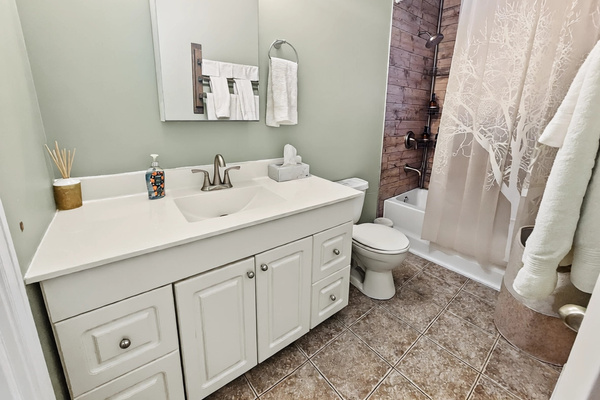 Full bathroom with tub and shower