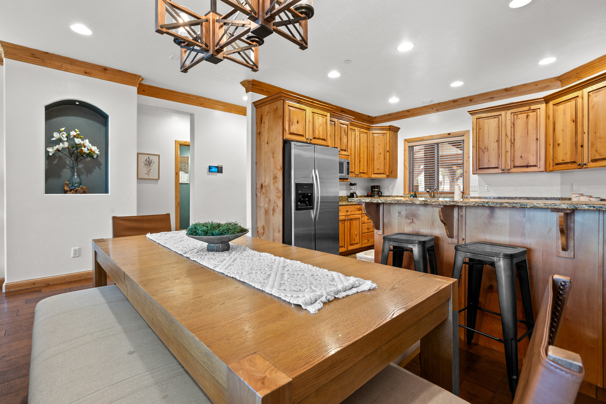 Spacious dining area conveniently located beside the kitchen with plenty of seating for your group.