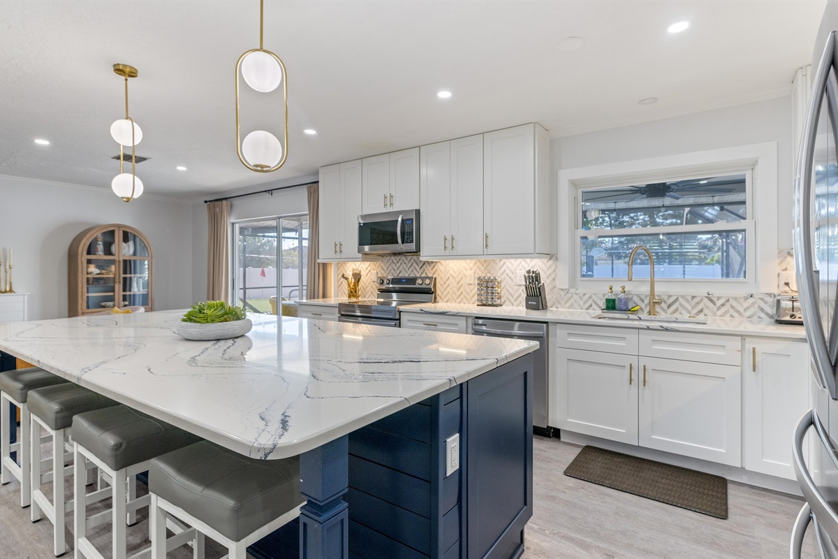 Functional kitchen stocked with key appliances—stove, oven, microwave, dishwasher, and all the essentials.