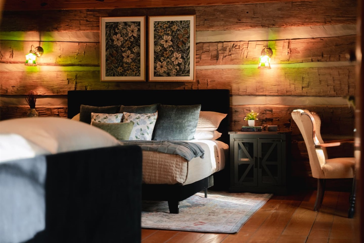 Loft bedroom with plush bedding, offering a serene retreat for a restful night’s sleep.